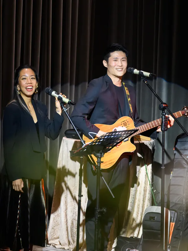 Roseville performing on stage at a corporate dinner