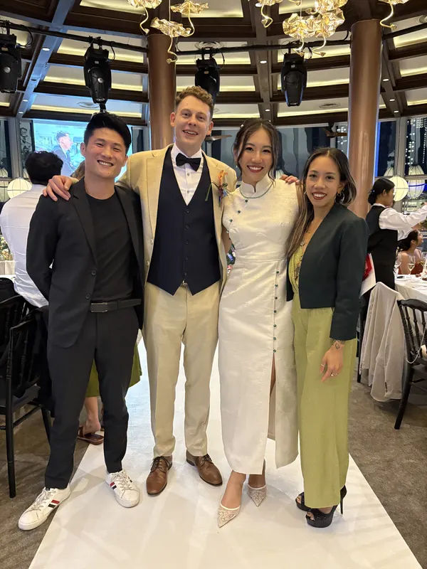 Roseville with the couple at a wedding reception